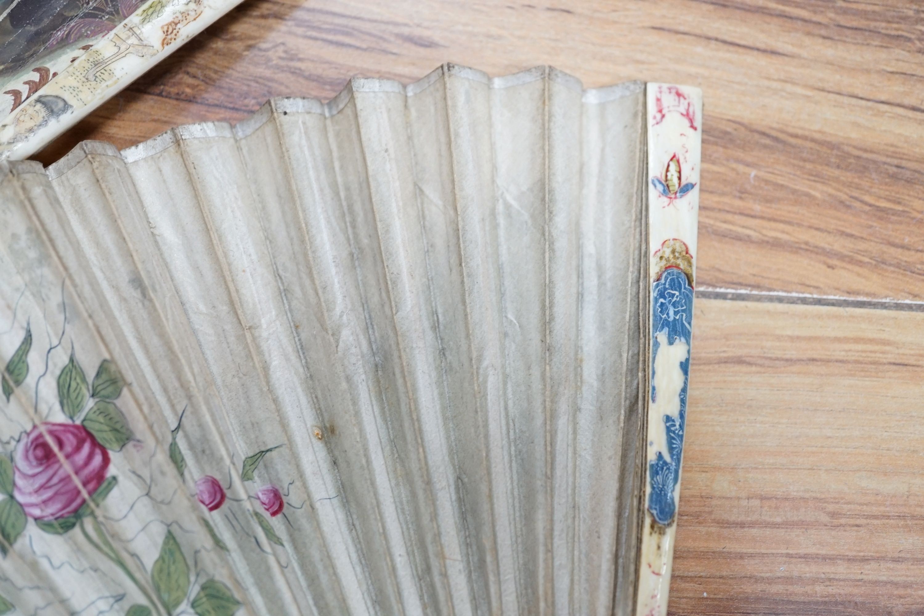 Five various fans, and an 18th century painted leaf fan with ivory chinoiserie decorated guards and sticks, 28 cms high (6)